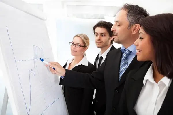 depositphotos_11472087-stock-photo-group-of-business-at-presentation