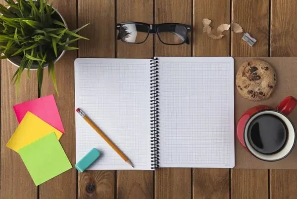 depositphotos_120098878-stock-photo-working-on-a-wooden-table