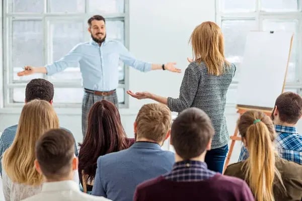 depositphotos_139227344-stock-photo-speaker-at-business-meeting-in