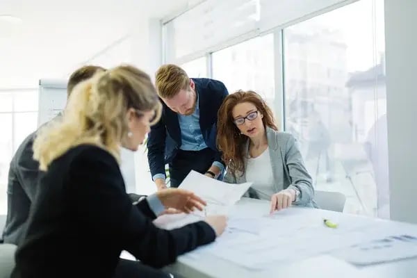 depositphotos_145045301-stock-photo-business-colleagues-working-in-office