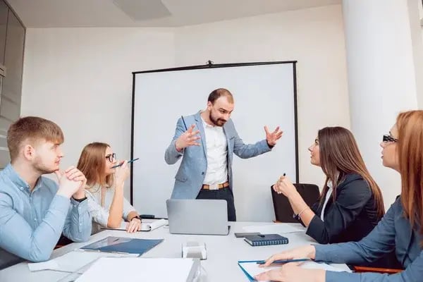 depositphotos_176145336-stock-photo-team-meeting-discussion-business-strategy