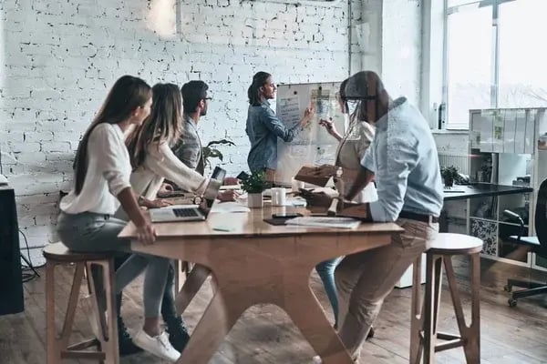 depositphotos_189590866-stock-photo-group-young-business-people-discussing