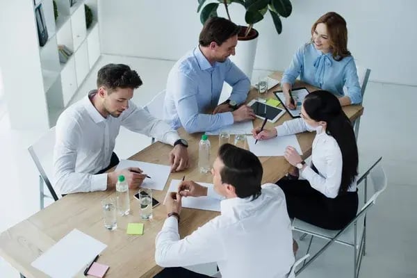 depositphotos_195980424-stock-photo-high-angle-view-business-colleagues