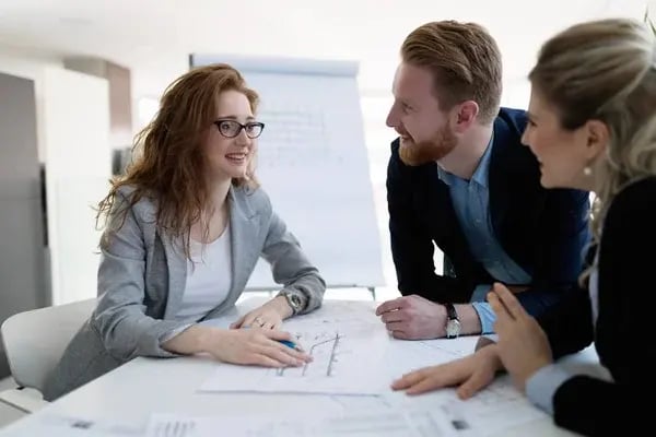depositphotos_198492692-stock-photo-group-young-architects-working-together
