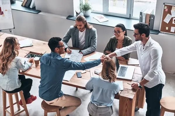depositphotos_225432758-stock-photo-top-view-business-people-brainstorming