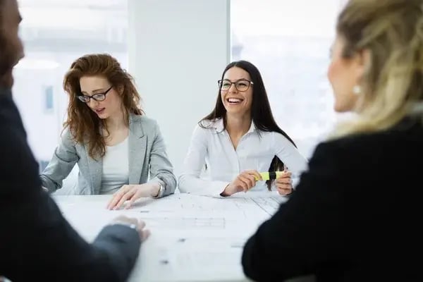depositphotos_231287170-stock-photo-cheerful-coworkers-office-company-meeting