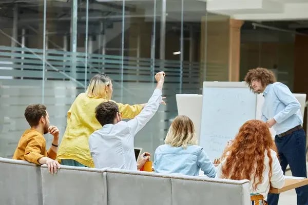 depositphotos_314688698-stock-photo-team-of-young-designers-at