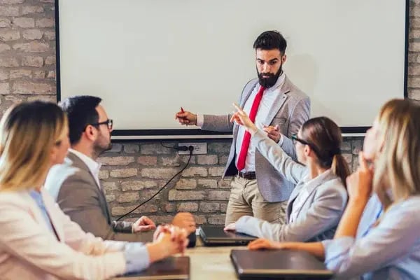 depositphotos_317360989-stock-photo-confident-speaker-giving-public-presentation