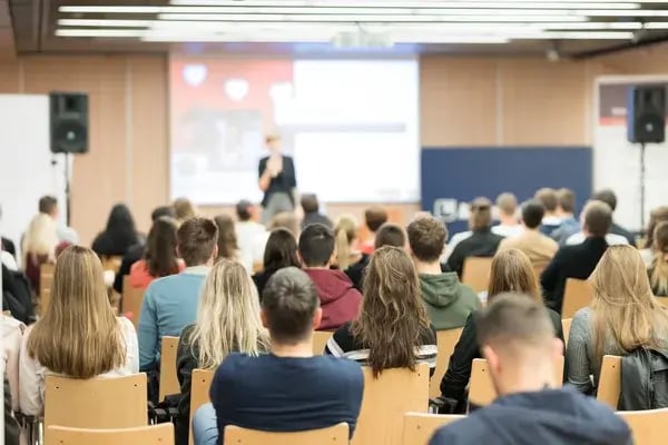 depositphotos_324757754-stock-photo-female-speaker-giving-presentation-on