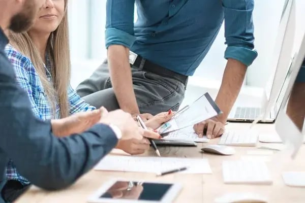 depositphotos_329963214-stock-photo-close-up-business-team-analyzing
