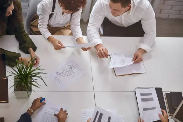 depositphotos_344675480-stock-photo-top-view-on-business-people (1)