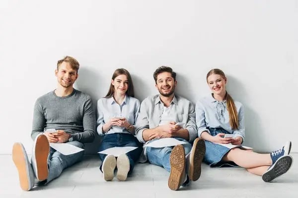 depositphotos_358866510-stock-photo-group-young-applicants-resume-smartphones