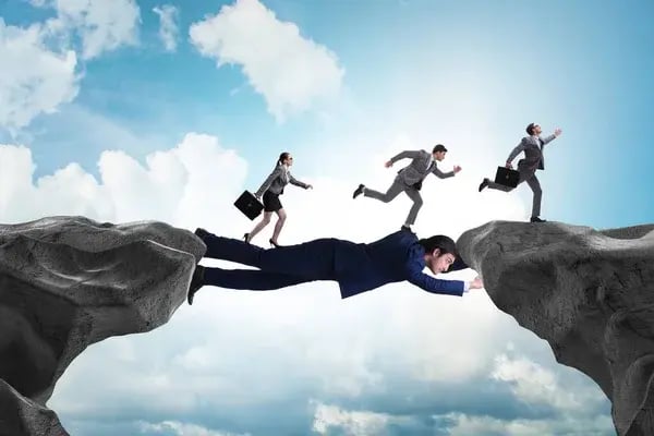 depositphotos_359333970-stock-photo-businessman-acting-as-a-bridge