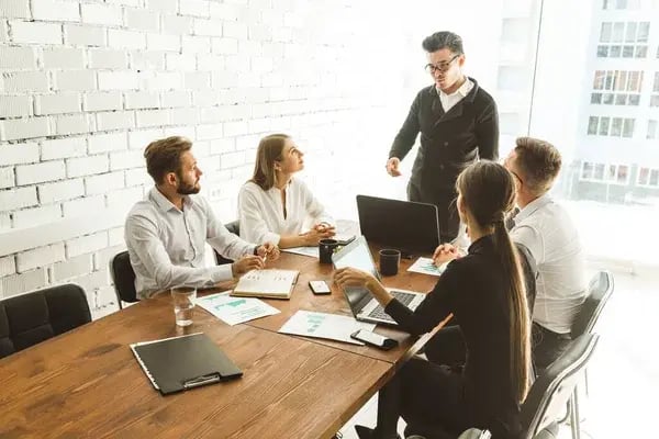 depositphotos_360958904-stock-photo-a-team-of-young-businessmen