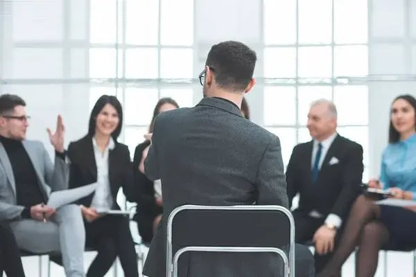 depositphotos_429703630-stock-photo-employees-asking-questions-at-a