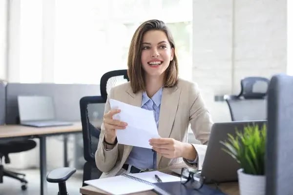 depositphotos_440969226-stock-photo-attractive-cheerful-business-woman-checking