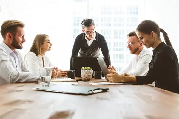 depositphotos_444790324-stock-photo-a-team-of-young-businessmen