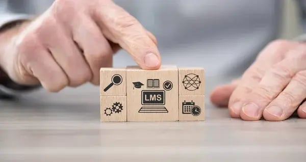 depositphotos_464881742-stock-photo-wooden-blocks-symbol-lms-concept