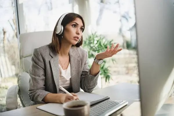 depositphotos_470115316-stock-photo-worried-business-woman-headphones-using