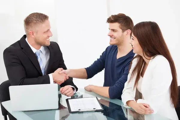 depositphotos_47347193-stock-photo-financial-advisor-shaking-hand-with