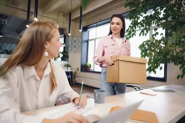 depositphotos_480120482-stock-photo-young-businesswoman-holding-box-of (1)
