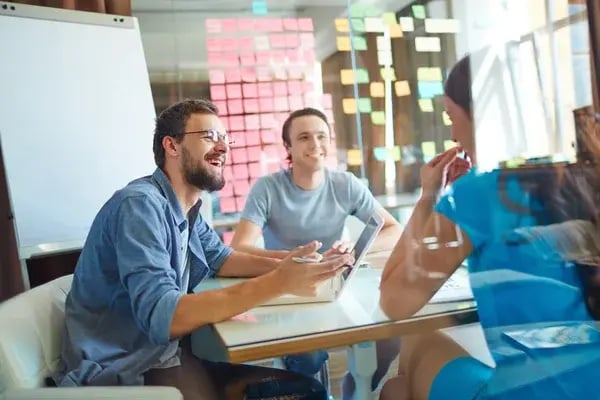 depositphotos_53801077-stock-photo-young-business-partners-sharing-ideas