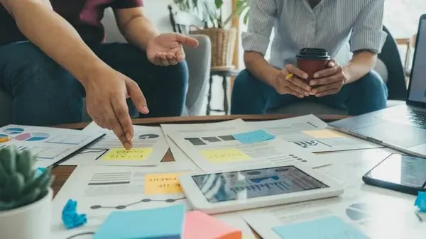 depositphotos_545695348-stock-photo-start-partners-discussing-ideas-new (1)