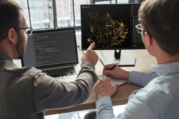depositphotos_639884352-stock-photo-closeup-two-men-data-science