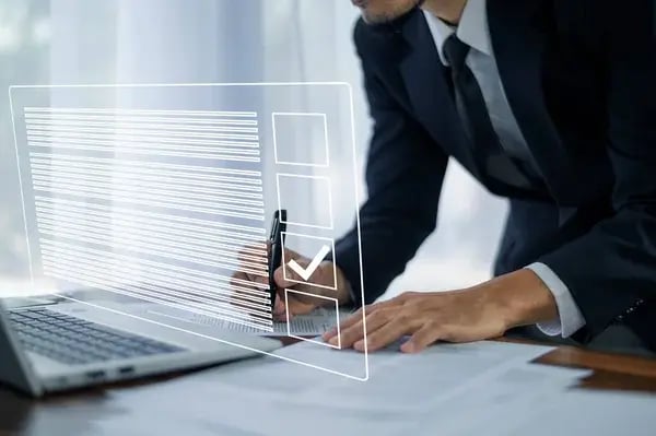 depositphotos_647701270-stock-photo-businessman-using-electronic-smart-checklist