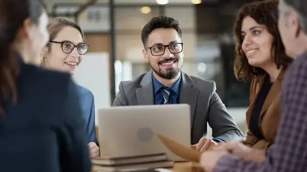 depositphotos_687424220-stock-photo-business-people-talking-office