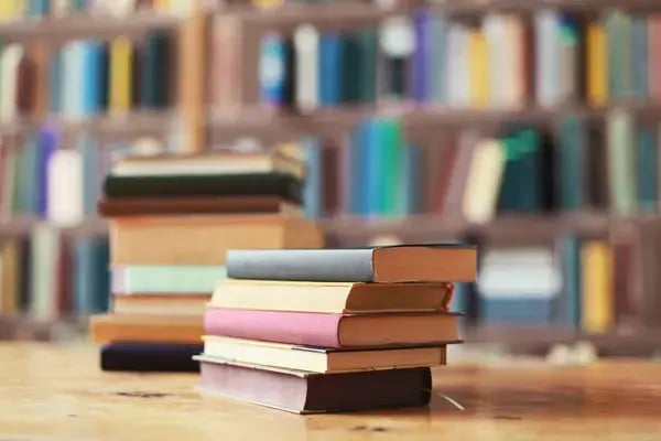 depositphotos_700752914-stock-photo-collection-history-books-encyclopedias-table