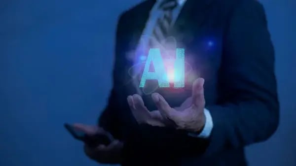 depositphotos_863699712-stock-photo-businessman-holding-artificial-intelligence-brain
